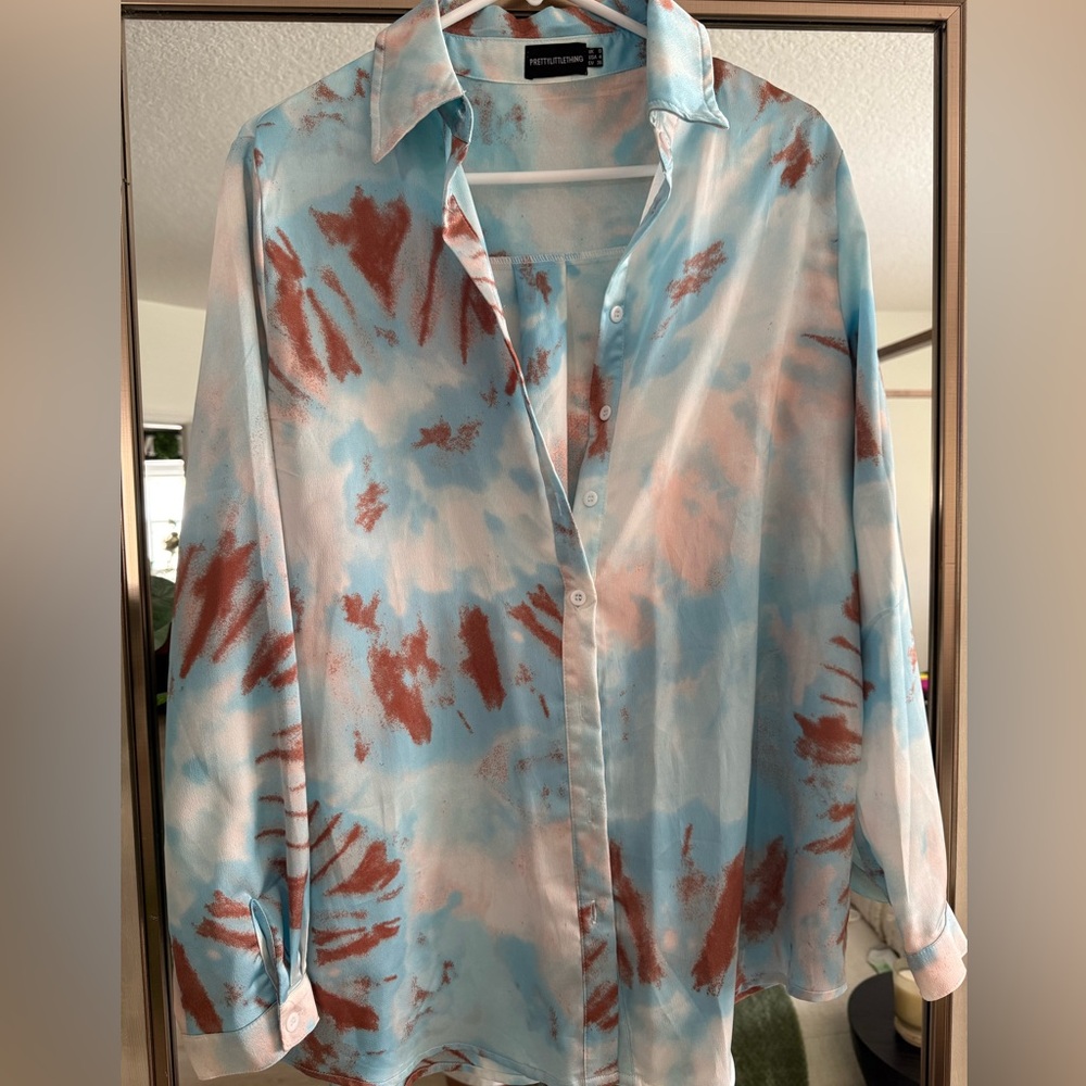 Multi color button down shirt.